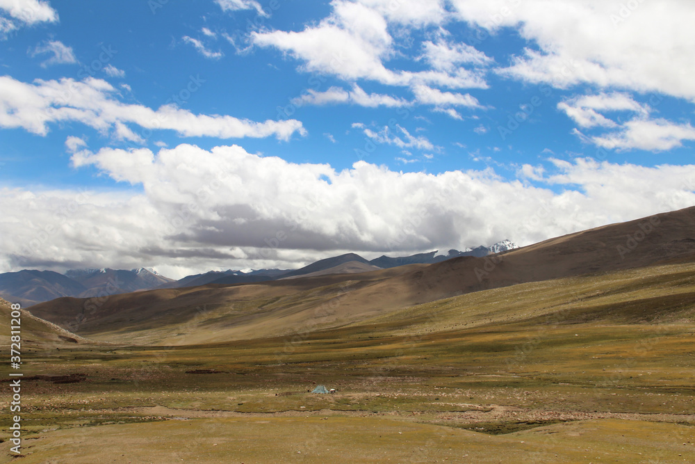View of the mountains and dramatic sky near Tingri on the way to Everest Base Camp, Tibet, China View of the mountains and dramatic sky near Tingri on the way to Everest Base Camp, Tibet, China