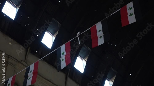 Small Syrian Flags Under Roof of Traditional Market in Damascus, Syria photo