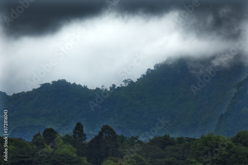 Raining cloud over the mountain and forest near border Thailand and Laos