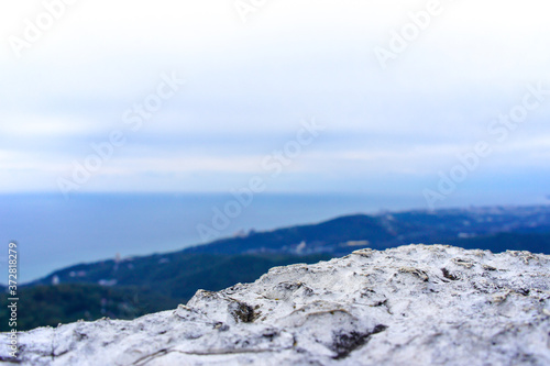 Mountain landscape. Blue sky and clouds. Blue sea