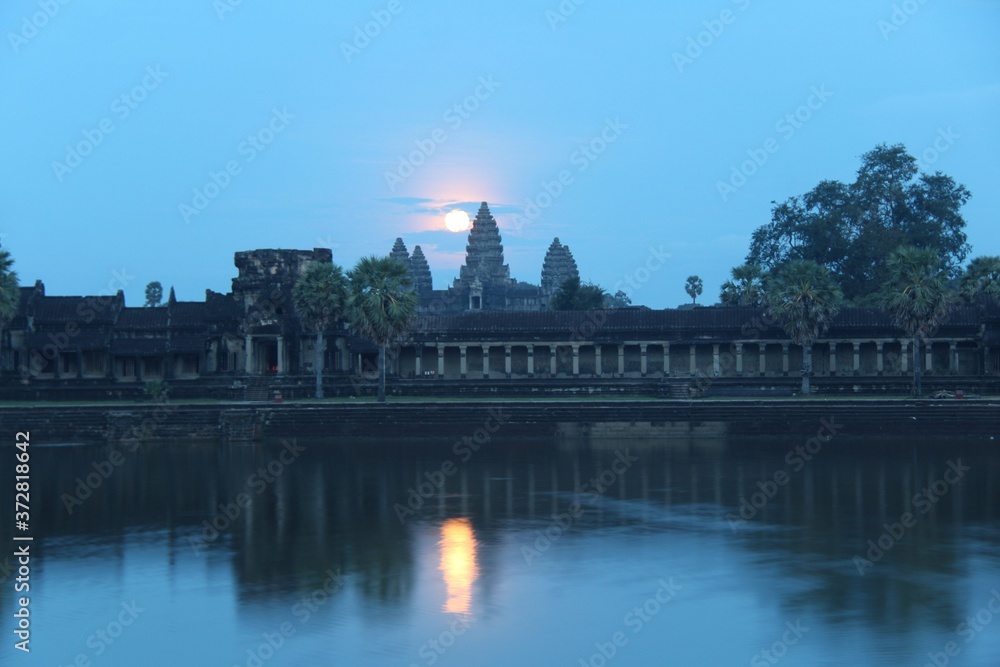 Fototapeta premium Cambodia. Siem Reap. Angkor Wat Temple. Full Moon over Angkor. The Temple was built at the beginning of the 12th century.