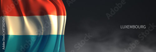Foto Luxembourg Flag with Dark Background