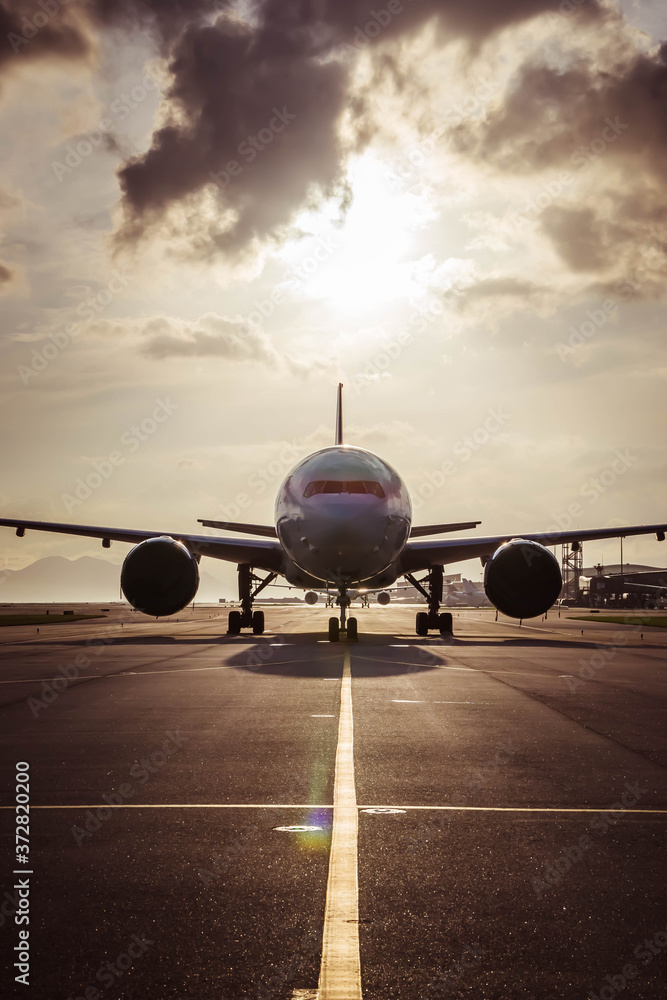 Naklejka premium Aircraft taxiing to airport runway