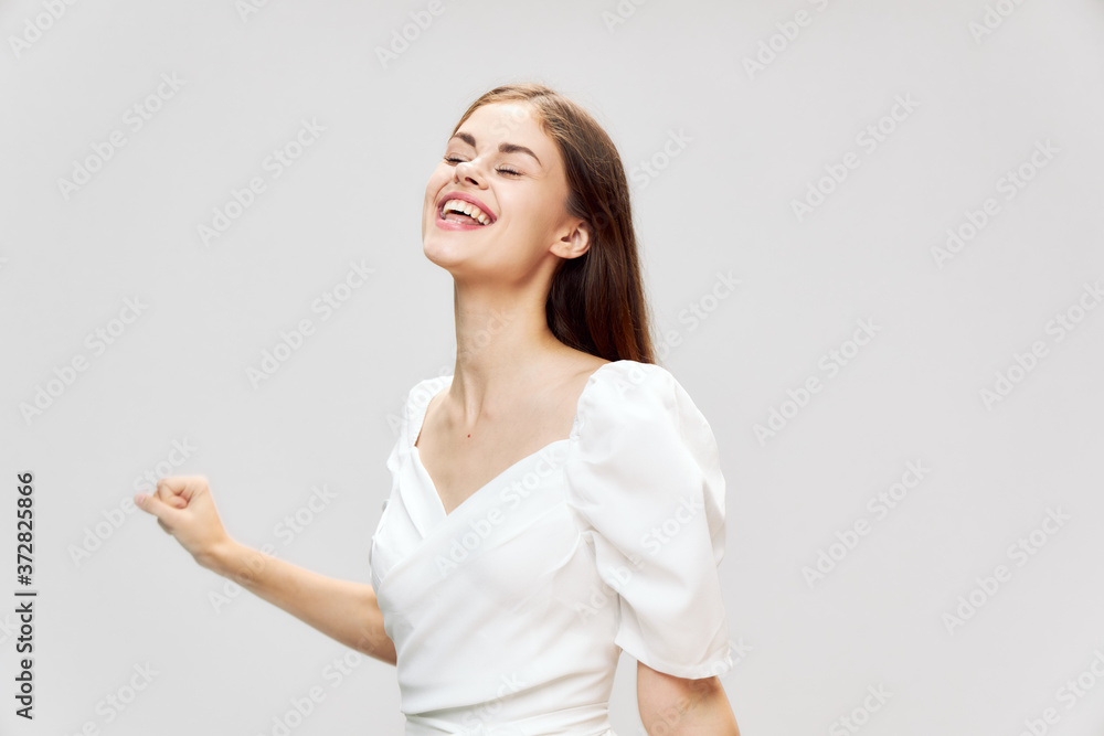 woman with closed eyes smile white dress cropped view studio woman with closed eyes smile white dress cropped view studio