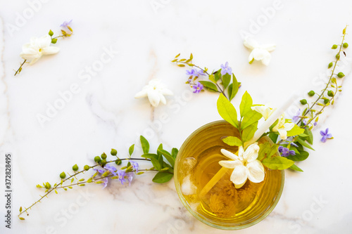 herbal healthy drinks cold chrysanthemum tea local flora of asia with flower jasmine in summer season arrangement flat lay style on table 