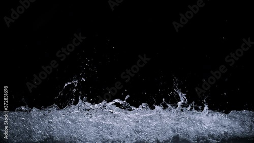 Wallpaper Mural Abstract splashing water wave isolated on black background. Studio super slow motion shot with clear pure drinking water on cutout high key background splashing onto pov glass in high speed. Torontodigital.ca