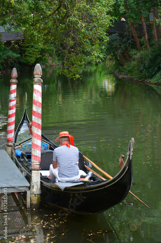 gondola and gondolier  standing in a romantic canal in Bamberg, Germany