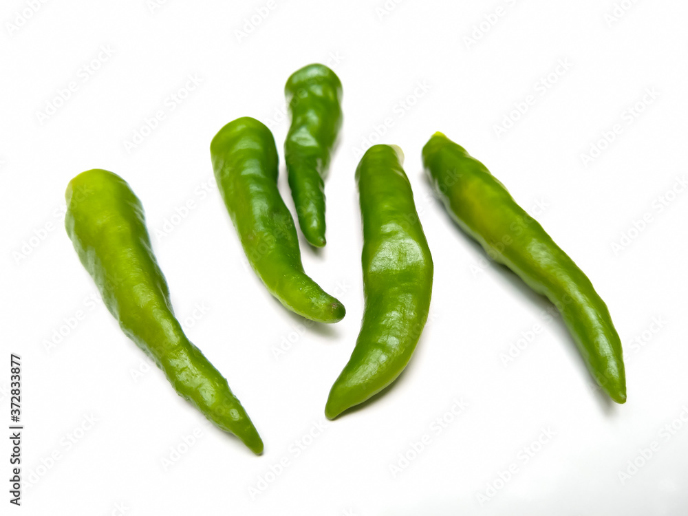 green chili peppers on white background green chili peppers on white background