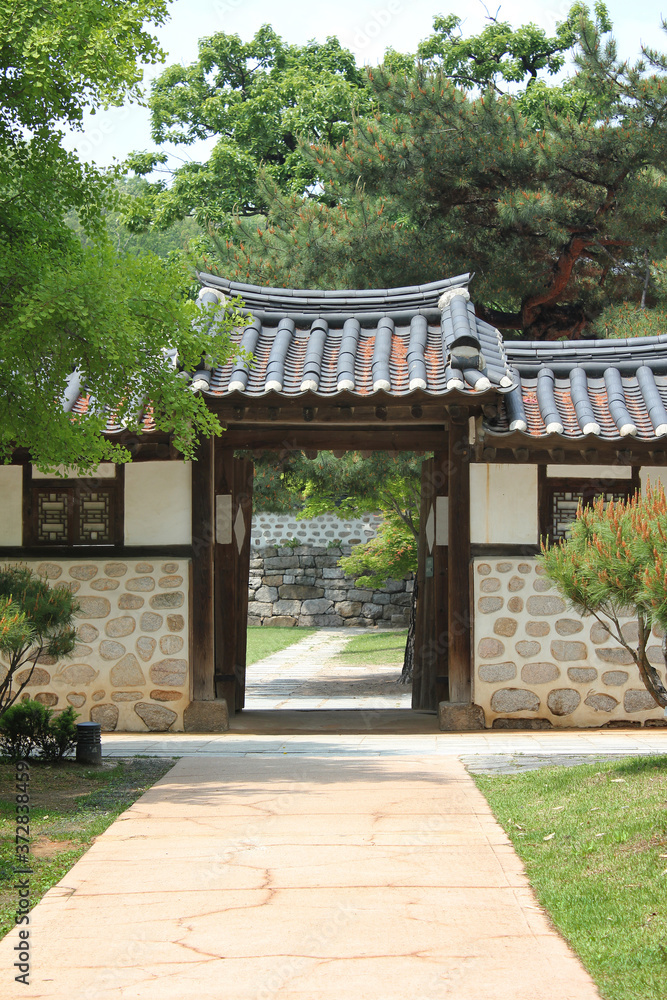 Traditional Korean hanok the entrance and Stone wall. Traditional Korean hanok the entrance and Stone wall.