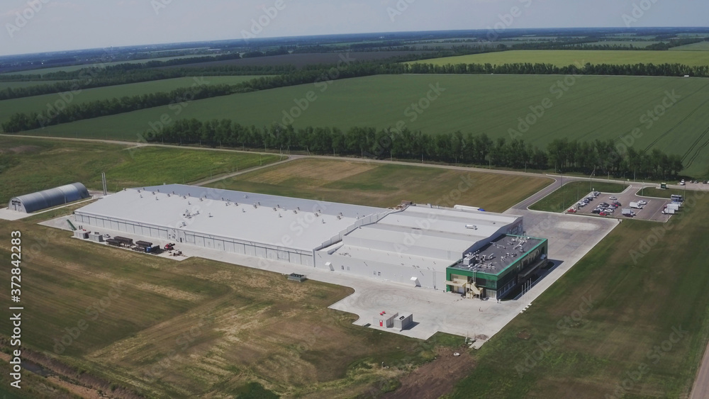 Fototapeta premium Aerial or flying over the mushroom production farm. Modern agriculture. Food production. Vegetarian food