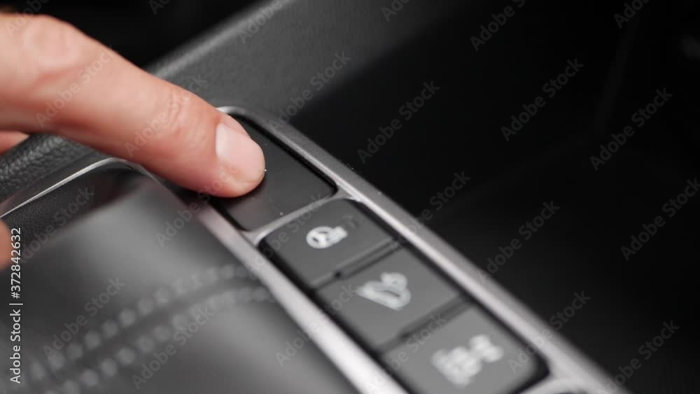 Switching ON heated seats of car by pressing the buttons. Heated seat dashboard in a car Switching ON heated seats of car by pressing the buttons. Heated seat dashboard in a car