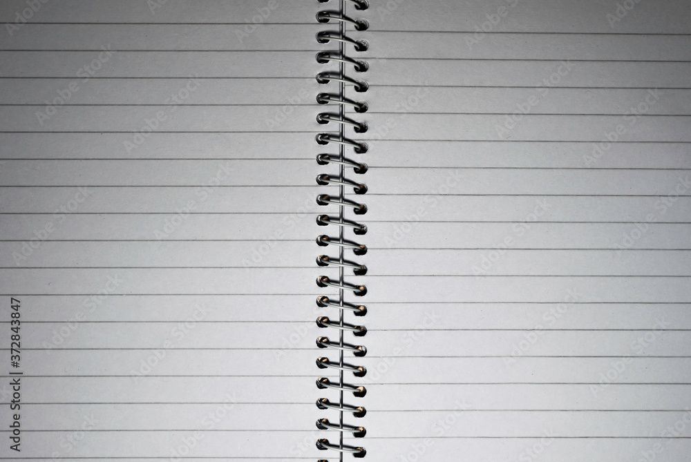 a binded blank white notebook page a binded blank white notebook page