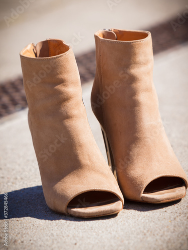 Foto Brown boots with high heels and peep toes