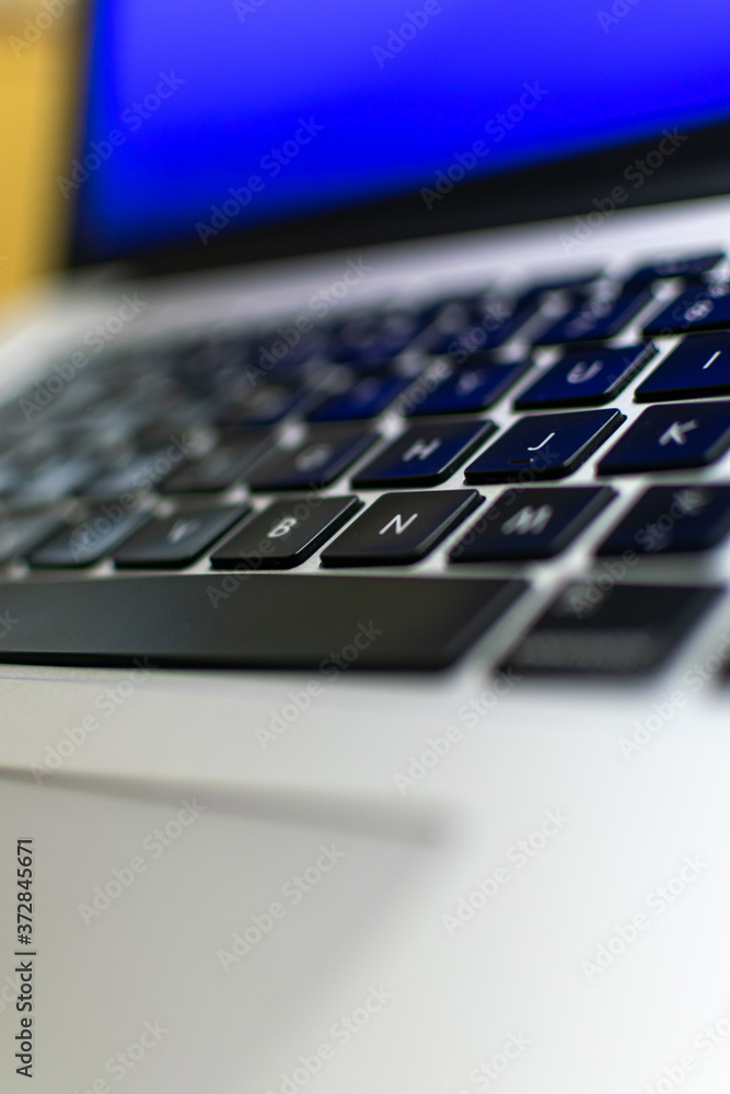 A selective focused view of a laptop key board with blurred edges A selective focused view of a laptop key board with blurred edges