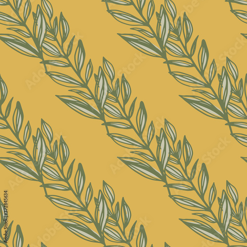 Doodle seamless pattern with autumn contoured leaves branches shapes. Orange background.