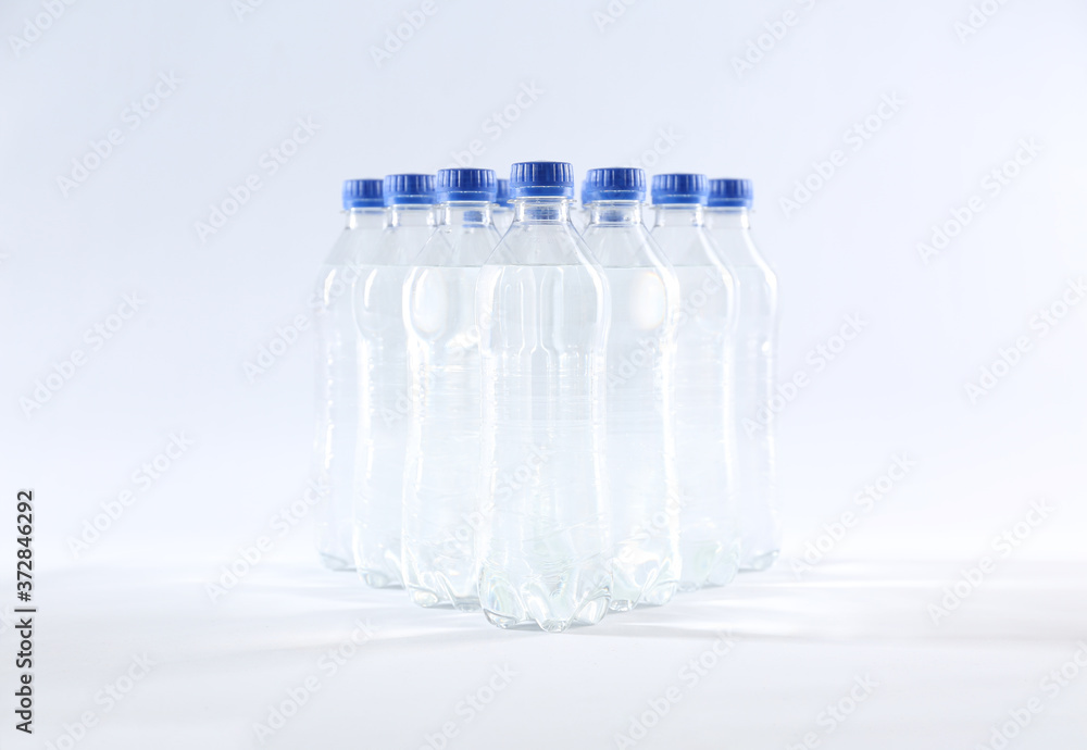 Plastic bottles with pure water on white background Plastic bottles with pure water on white background