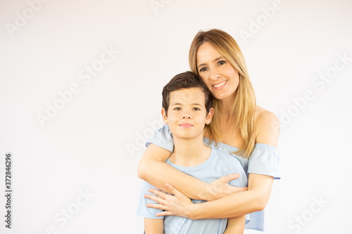 Beautiful woman hugging her son