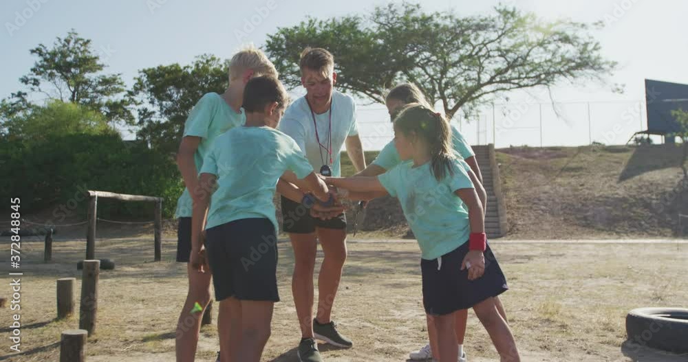 Group of Caucasian boys and girls at boot camp together Group of Caucasian boys and girls at boot camp together