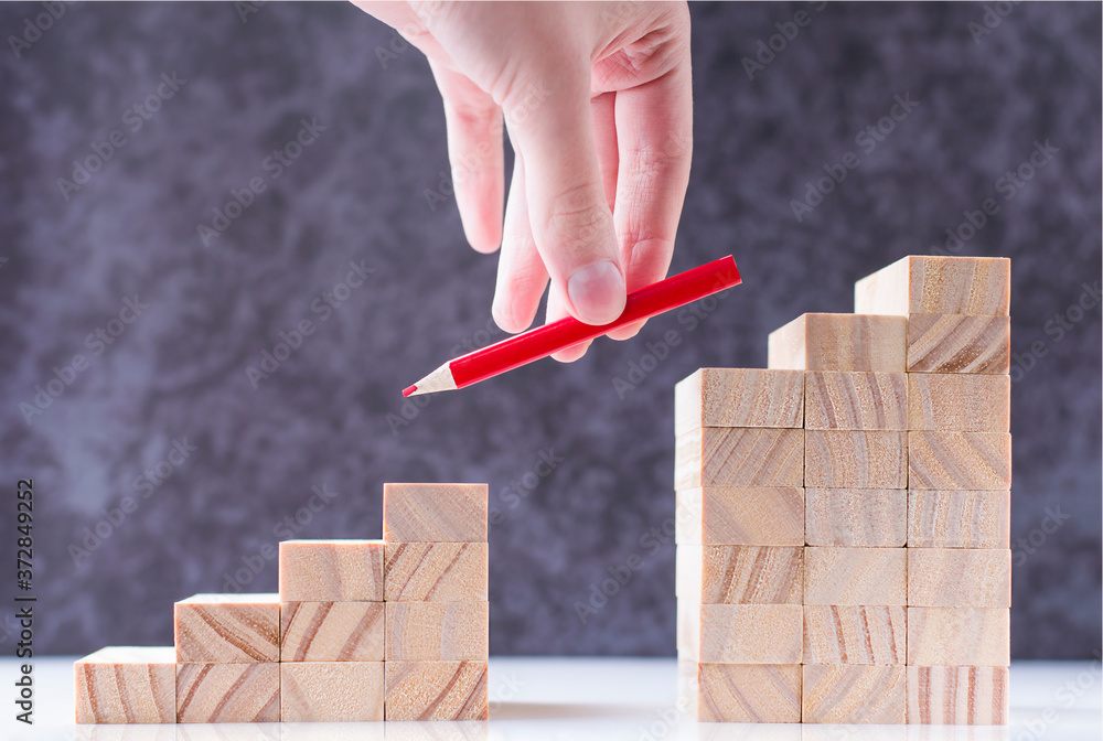 Hand Rungs hand puts a pencil on the missing rungs of the stairs Stock Photo ...