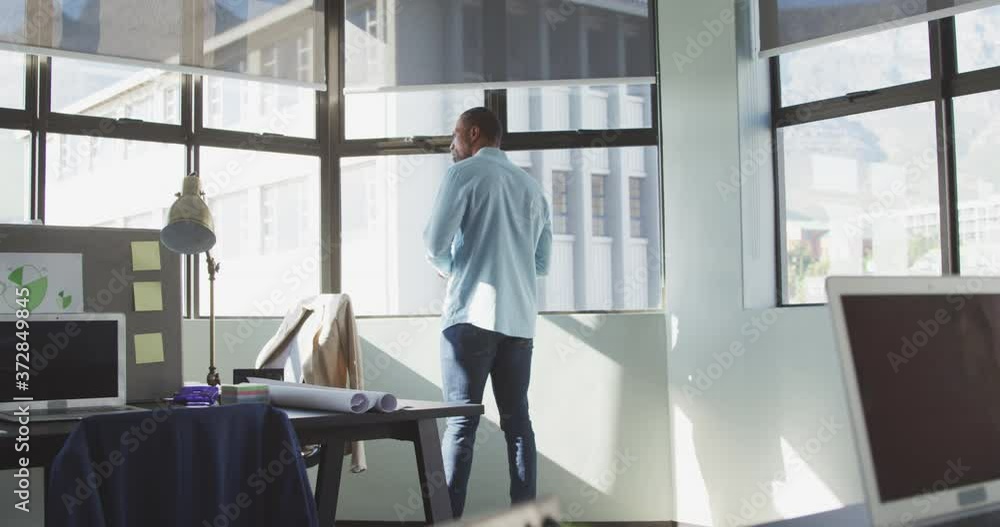 Businessman looking away in modern office Businessman looking away in modern office