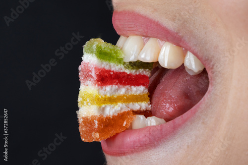 Wallpaper Mural colored marmalade in the teeth of a girl Torontodigital.ca