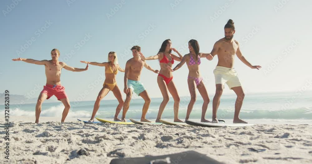 Friends training surf styling on the sand Friends training surf styling on the sand