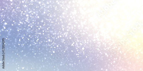 Bright shine on winter defocus empty background. Snowfall texture on blue lilac yellow ombre.