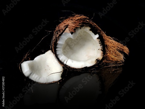 Coconut cut pise isolated on Black background with revelation 
