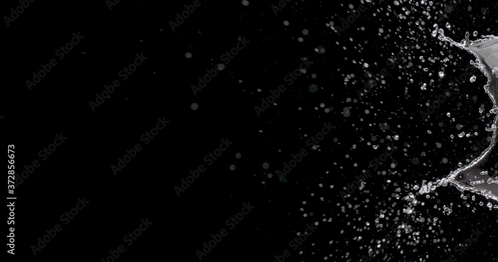 water droplets splattering against a black background.