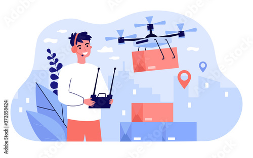 Cheerful delivery manager controlling drone carrying box. Man using remote control device, operating quadcopter, distributing parcel. For courier service, mobile transport, shipping concept