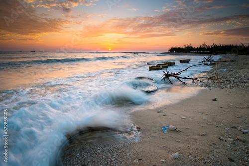 Fototapeta Naklejka Na Ścianę i Meble -  golden sky sunrise at the beach tuban east java indonesia
