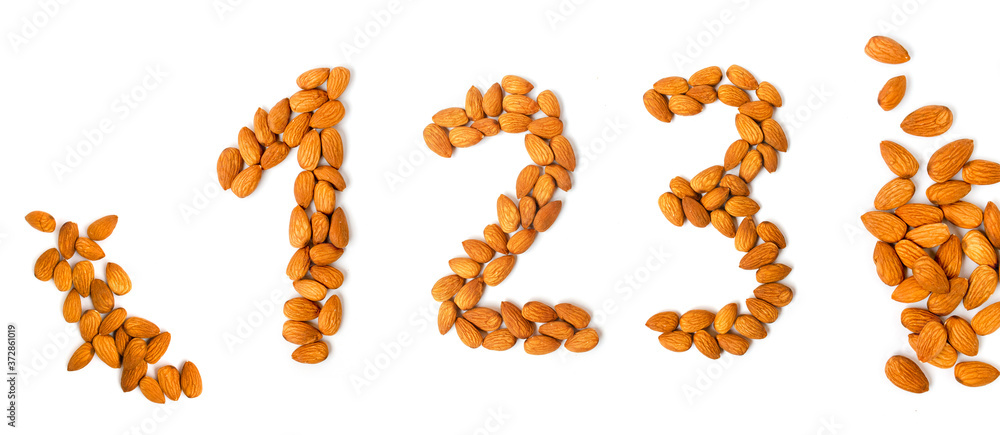 Isolated numbers made of almonds on white background. Isolated numbers made of almonds on white background.