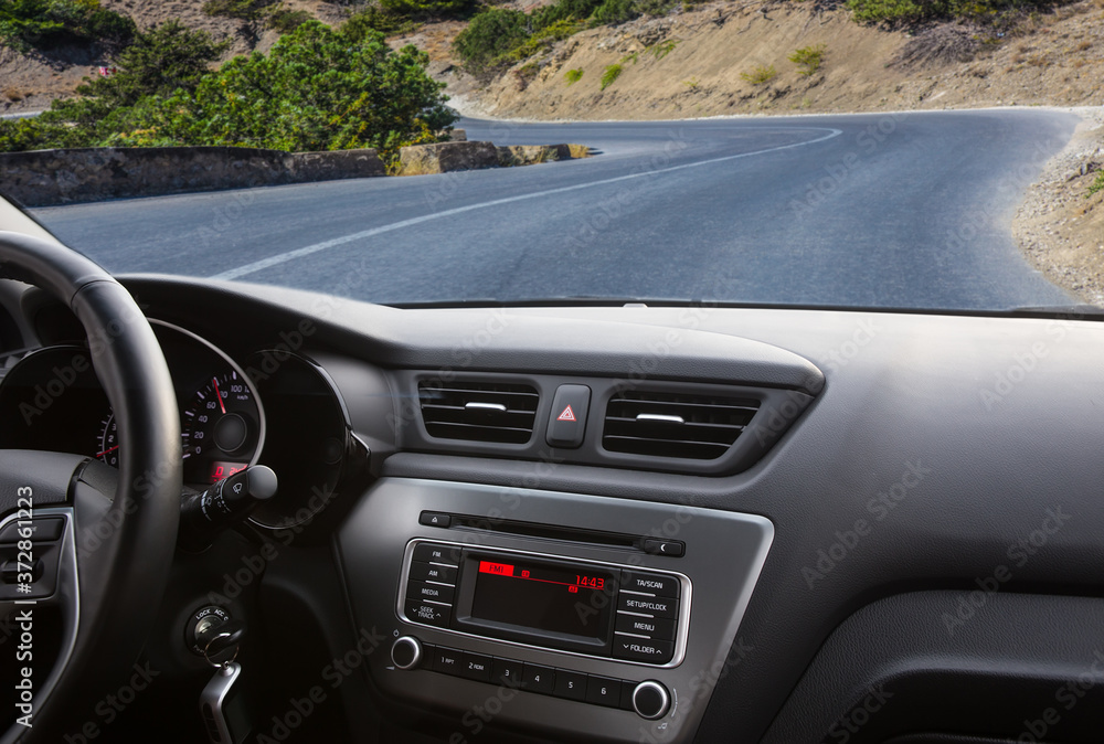 View from a riding car on a mountain road. View from a riding car on a mountain road.