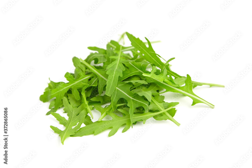 Heap of fresh arugula or rocket salad leaves isolated on white background Heap of fresh arugula or rocket salad leaves isolated on white background