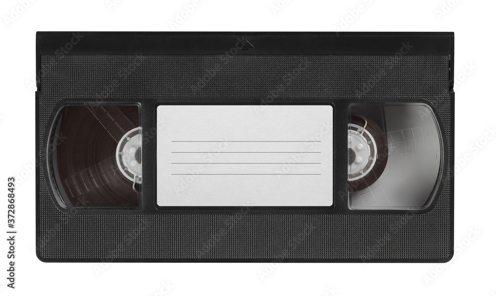 Naklejka premium old video cassette tape with blank label top view isolated on white