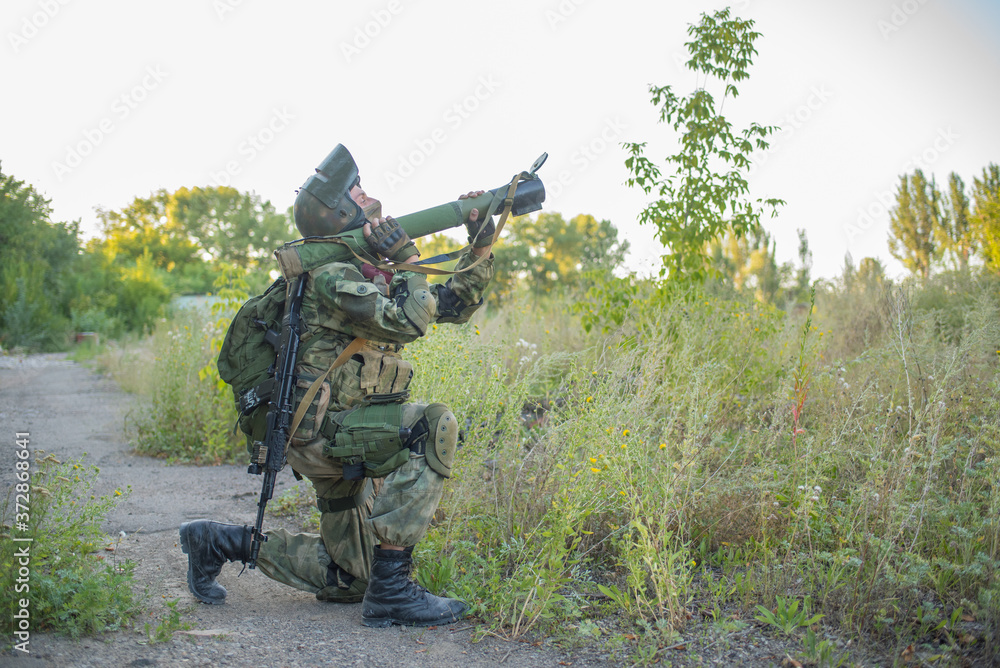 Airsoft grenade launcher aiming at an object that needs to be destroyed Airsoft grenade launcher aiming at an object that needs to be destroyed