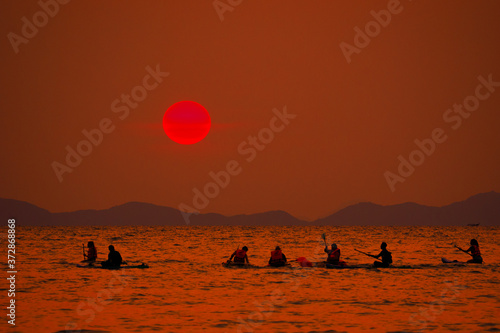 People kayakking in West Railay beach at sunset. Krabi  Thailand