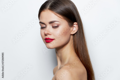 Charming woman look down naked shoulders side view red lips 