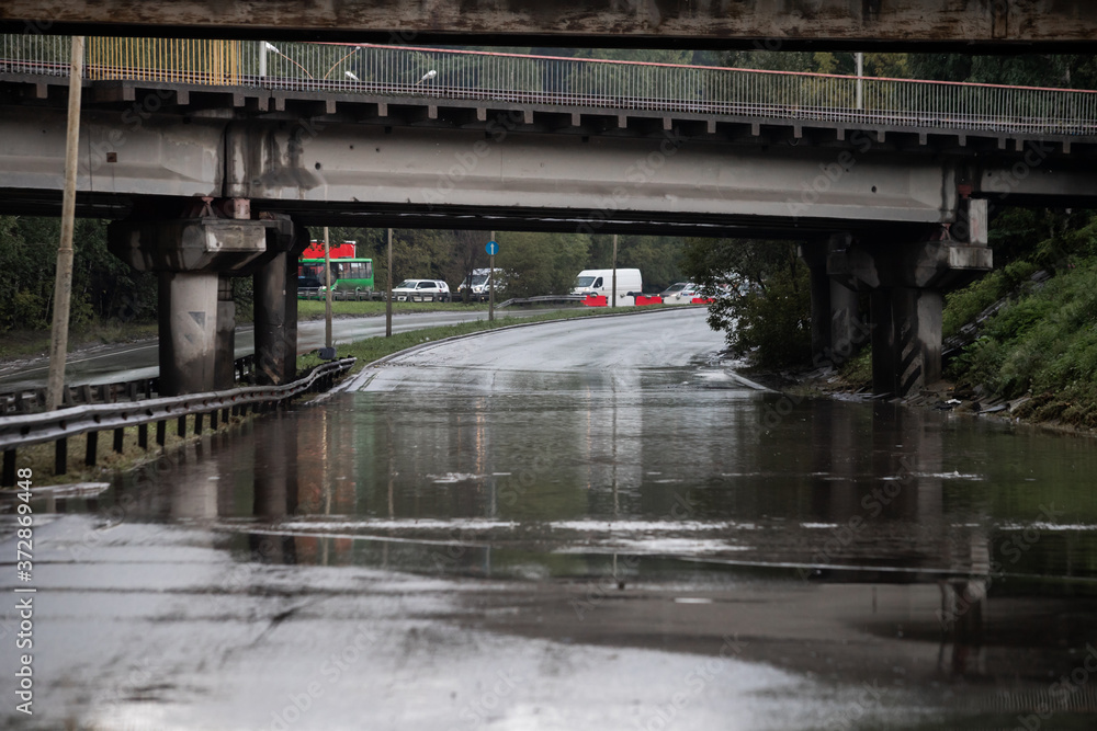 Heavy rain and puddles on the road slowing the traffic down Heavy rain and puddles on the road slowing the traffic down