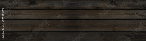 Old brown grunge rustic dark wooden texture - wood background panorama long banner wide 