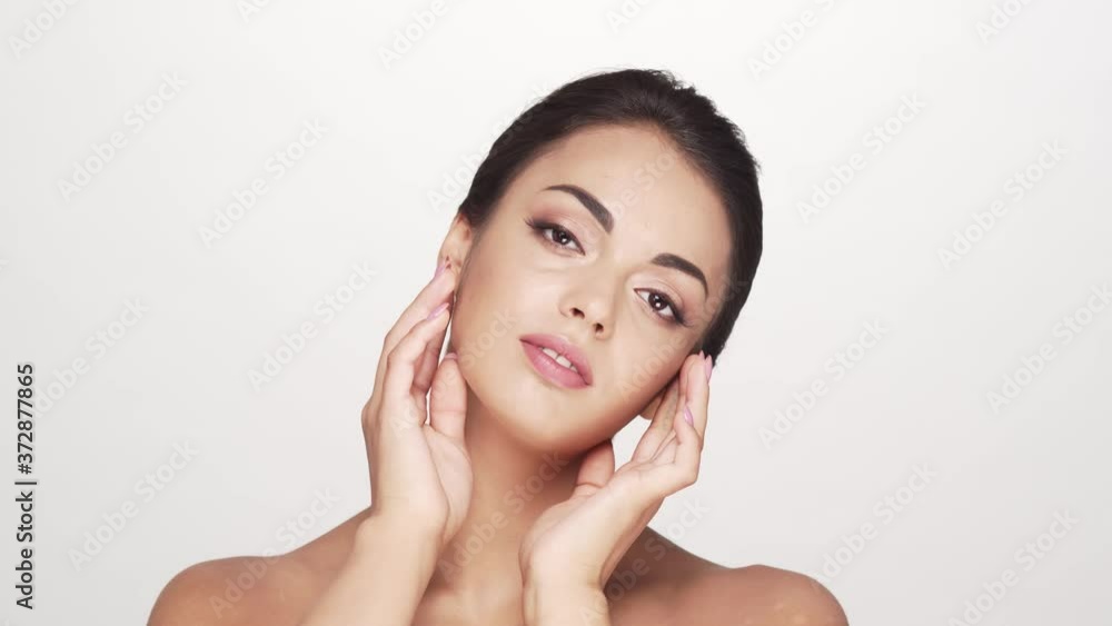Studio portrait of young and beautiful brunette woman