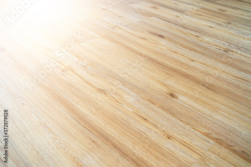 Wood laminate flooring texture background. Light wooden textured interior floor.