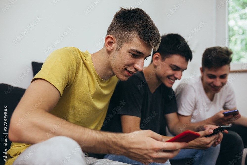 teenagers using mobile phones at home teenagers using mobile phones at home