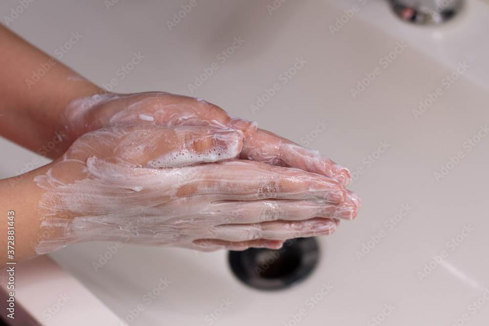 Fototapeta premium washing hands with soap