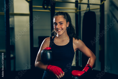 woman kick boxing or boxing training, posing
