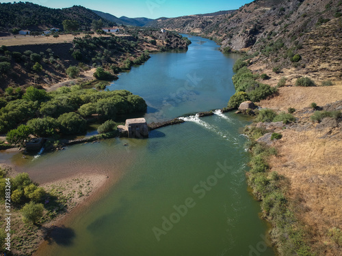 Aerial view from a river with an old water mill. Guadiana River in Portugal	 photo