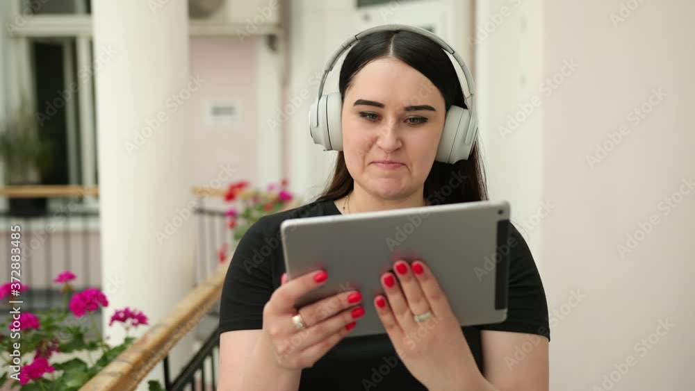 Spending quality time together video chatting, talking on tablet pc chat conversation. Using a digital gadget while walking, young contemporary confident people, perspective entrepreneur. headphones Spending quality time together video chatting, talking on tablet pc chat conversation. Using a digital gadget while walking, young contemporary confident people, perspective entrepreneur. headphones