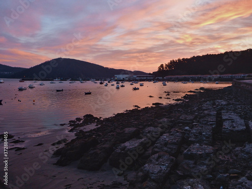 Cedeira, Galicia, Spain - Amazing sunset at the port.  Amazing warm colors of the sky photo