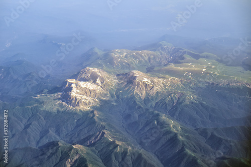 View from the plane to the Western Caucasus mountains. Fisht-Oshten massif. Adygeya, Russia. photo