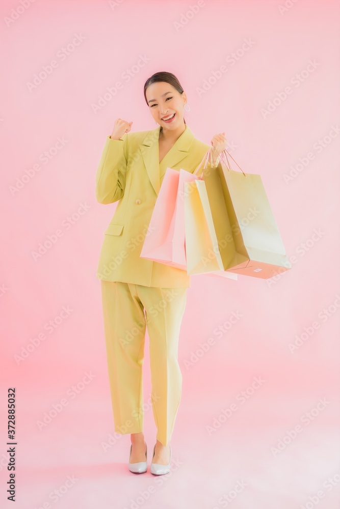 Portrait beautiful young asian business woman with shopping bag